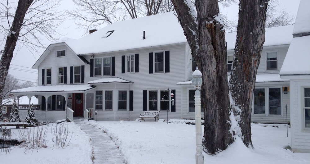 Picture of the home with snow.